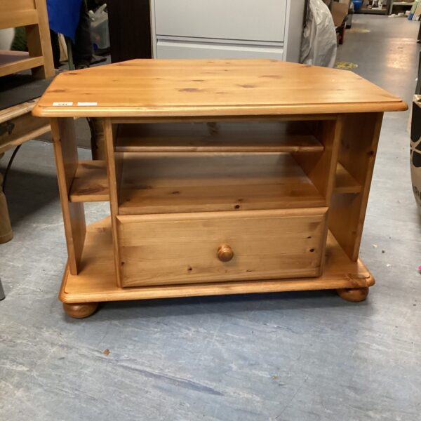 Front view of a rustic pine media cabinet with a single door.