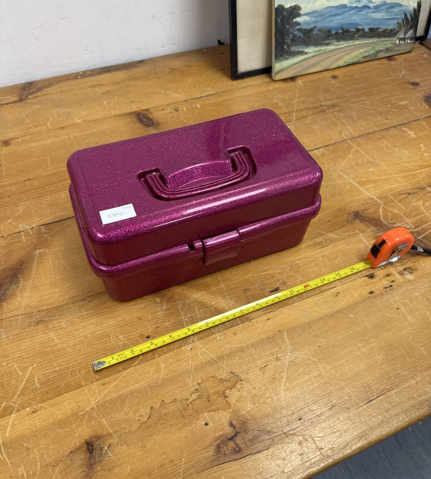 Exterior view of a pink glittery vintage jewellery box.