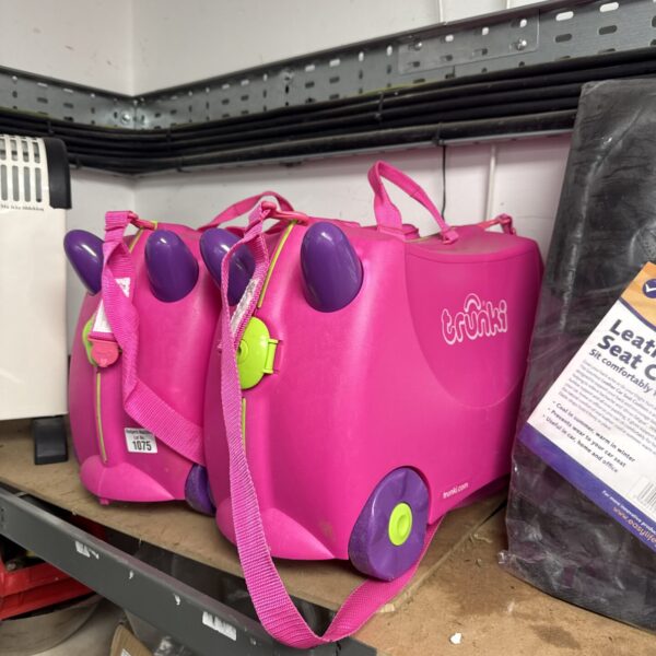 Pink Trunki ride-on suitcases for children’s travel.