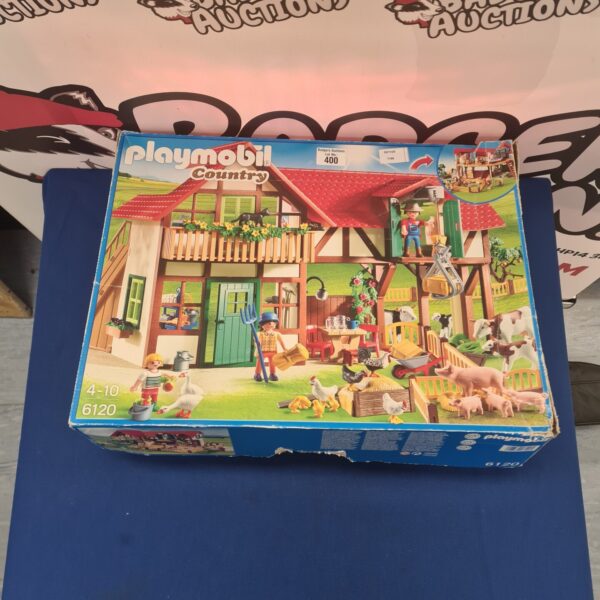 Boxed vintage Playmobil Country playset with farm scene illustration.
