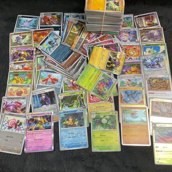 Large assortment of Pokemon trading cards for collectors.