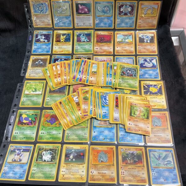 Large lot of Pokemon cards in a protective binder.