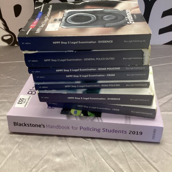 Bundle of police training manuals and handbooks for law enforcement.