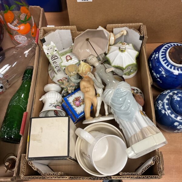 Tray of vintage porcelain figurines including Nao and cherub.