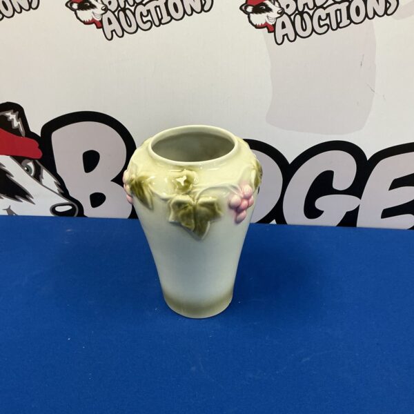 Antique porcelain vase with delicate floral design.