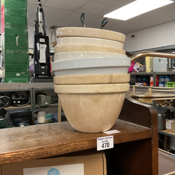 Stack of vintage white porcelain pudding bowls.