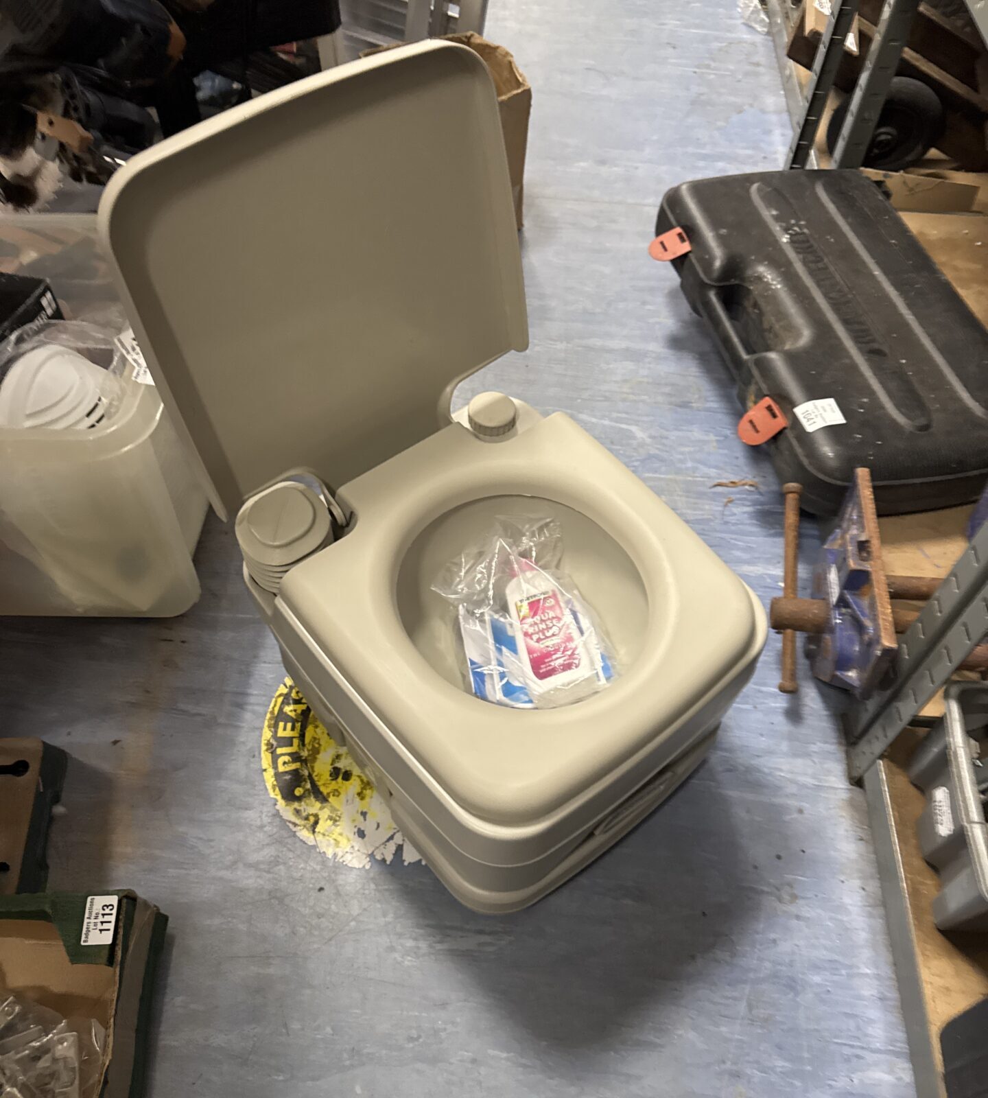 Portable Portalflush camping toilet for outdoor use.