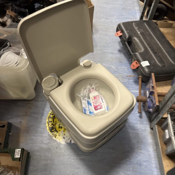 Portable Portalflush camping toilet for outdoor use.