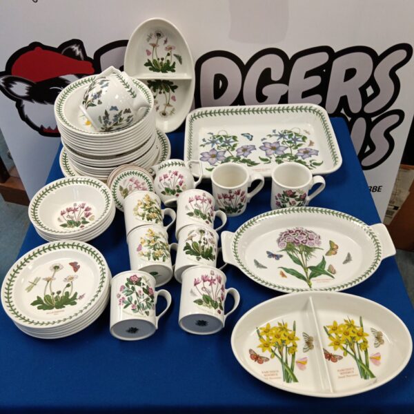 Large collection of Portmeirion Botanic Garden dinnerware with floral designs.
