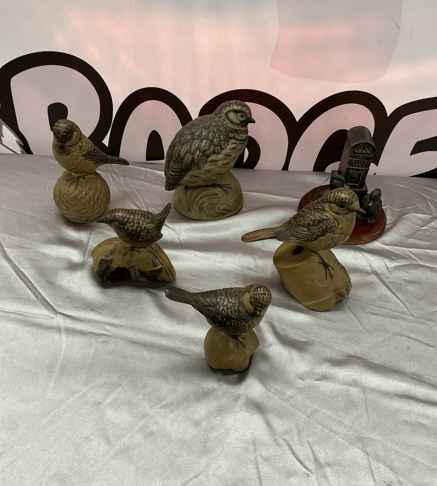 Six vintage pottery bird figurines displayed as a collection.