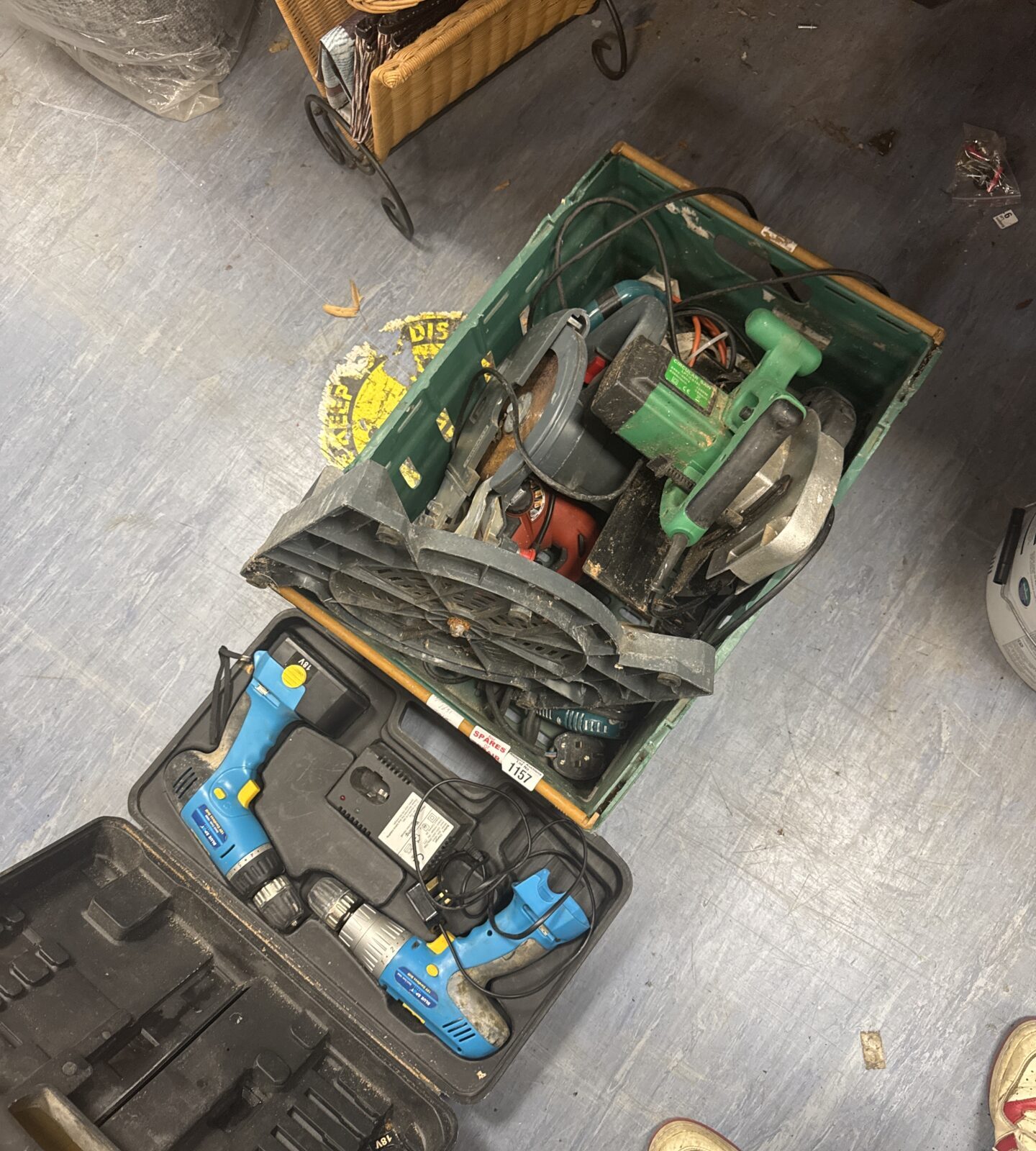 Open carrying case with assorted power tools inside.