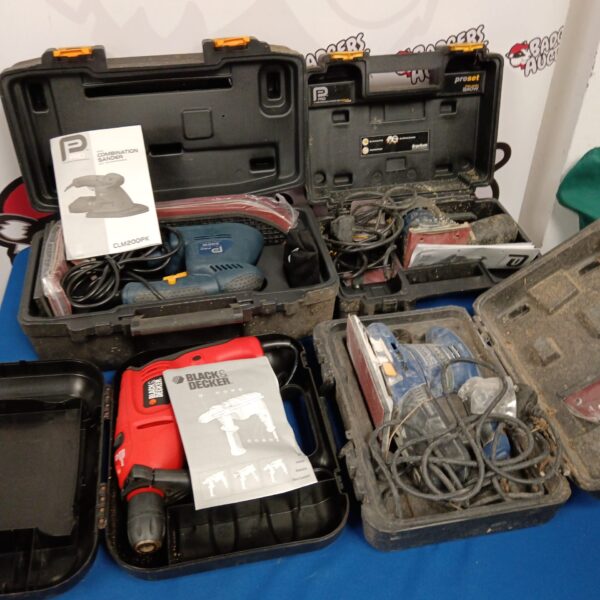Black and Decker power tool set with drill and sander in case.