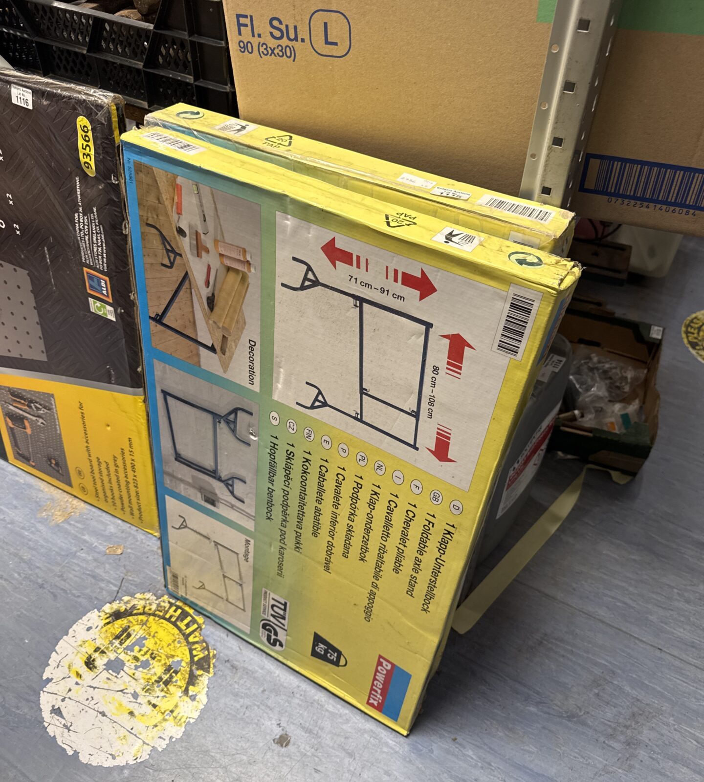 Two Powerfix folding clothes stands stacked together for storage.