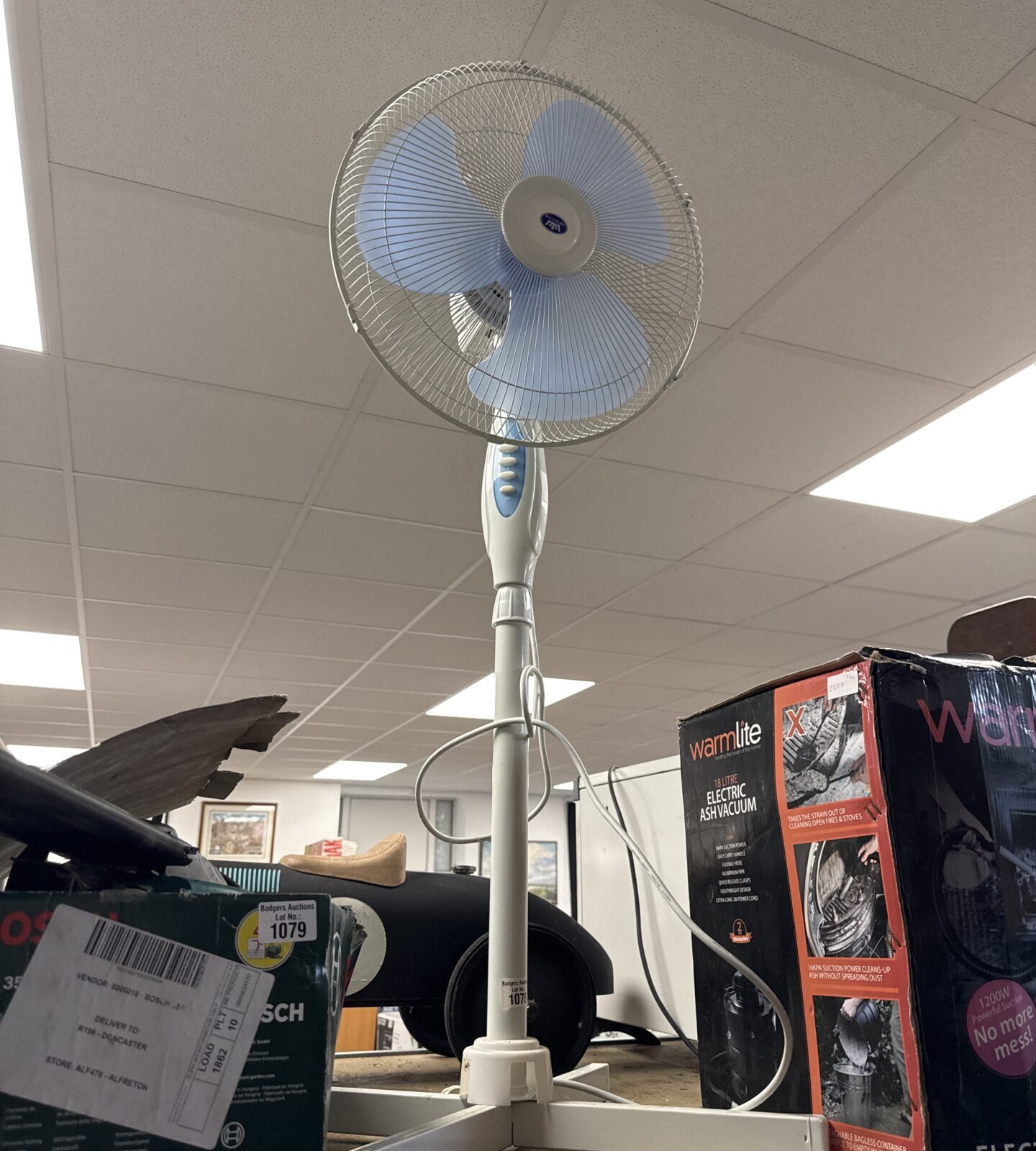 Vintage Prem-I-air pedestal fan for cooling and retro style.
