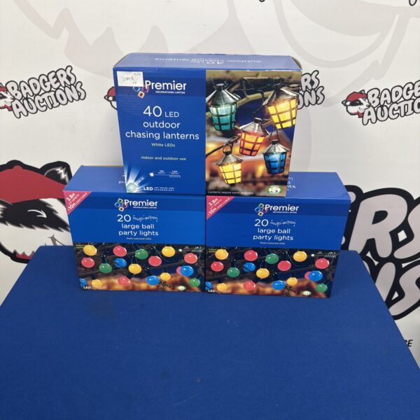 Three boxes of Premier Decorations chasing lantern lights in original packaging.