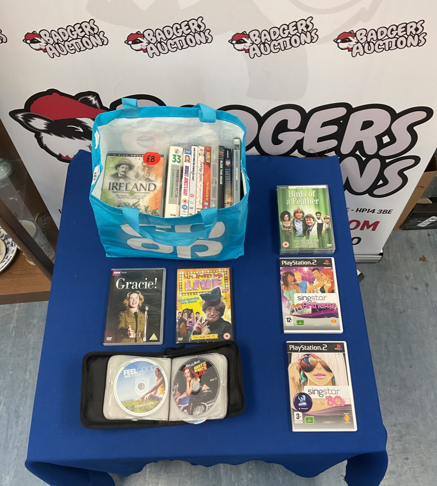 PS2 Singstar games and DVD lot for karaoke and gaming.