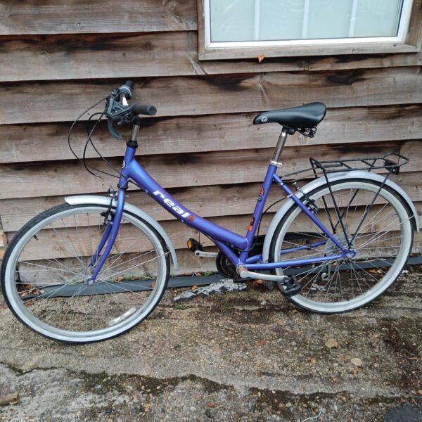 Purple ladies bicycle with step-through frame, ideal for commuting.
