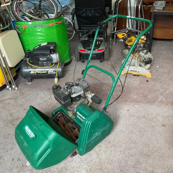 Vintage Qualcast Bosch classic petrol mower in used condition.