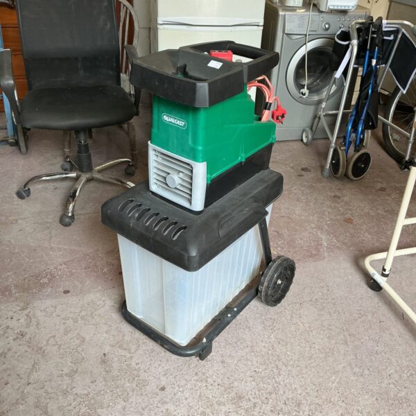 Qualcast electric garden shredder on wheels for garden waste disposal.
