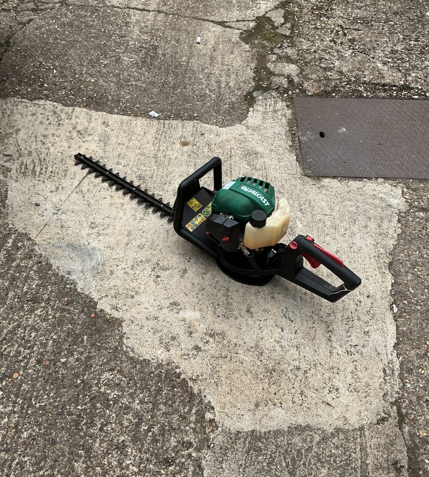 Used Qualcast petrol hedge cutter for garden maintenance.