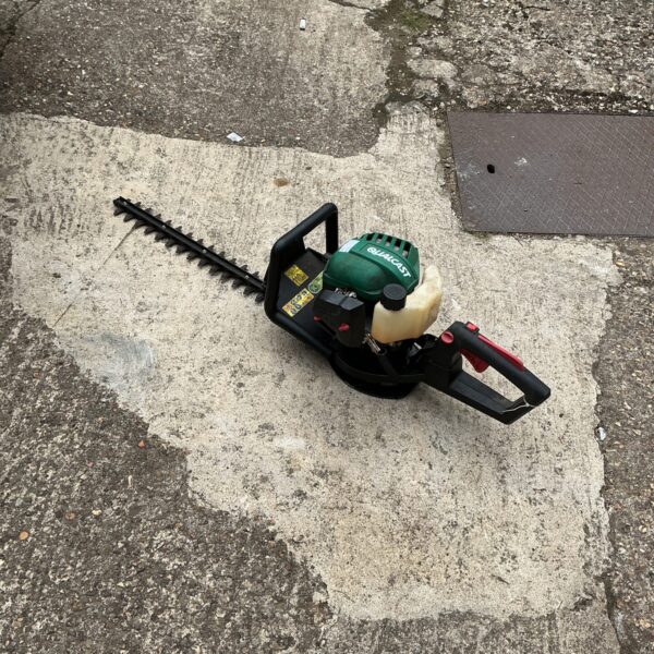 Used Qualcast petrol hedge cutter for garden maintenance.