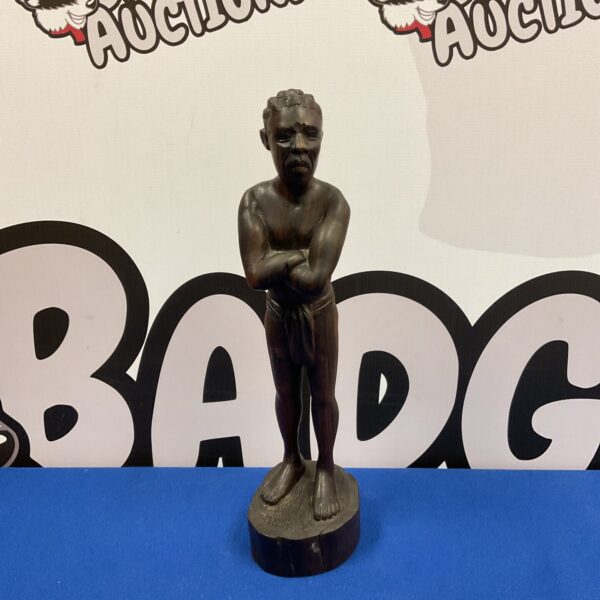 Vintage Rakotos African carving of a tribesman, detailed wood sculpture.