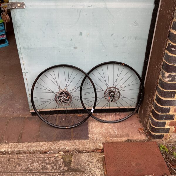 Pair of used Raleigh bike wheels for bicycle restoration.