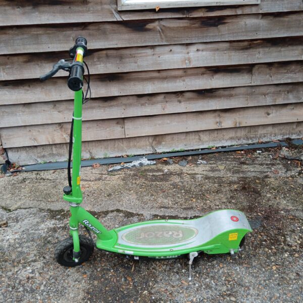 Green Razor electric scooter, untested condition, outdoor ride-on toy.