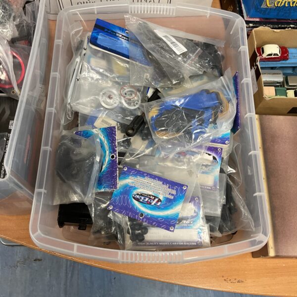 RC model parts lot including Ho Bao components for hobbyists.