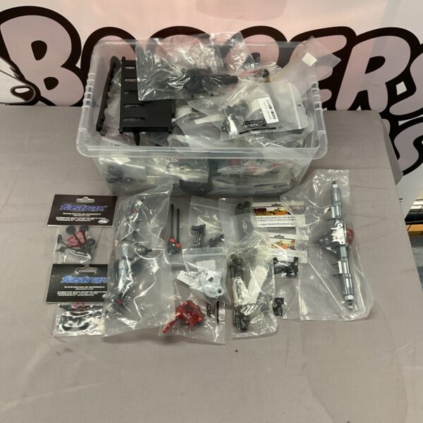 Assorted RC model parts and accessories for cars and airplanes.