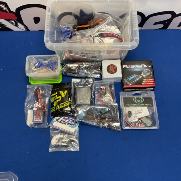 Mixed lot of RC model parts and accessories for hobbyists.
