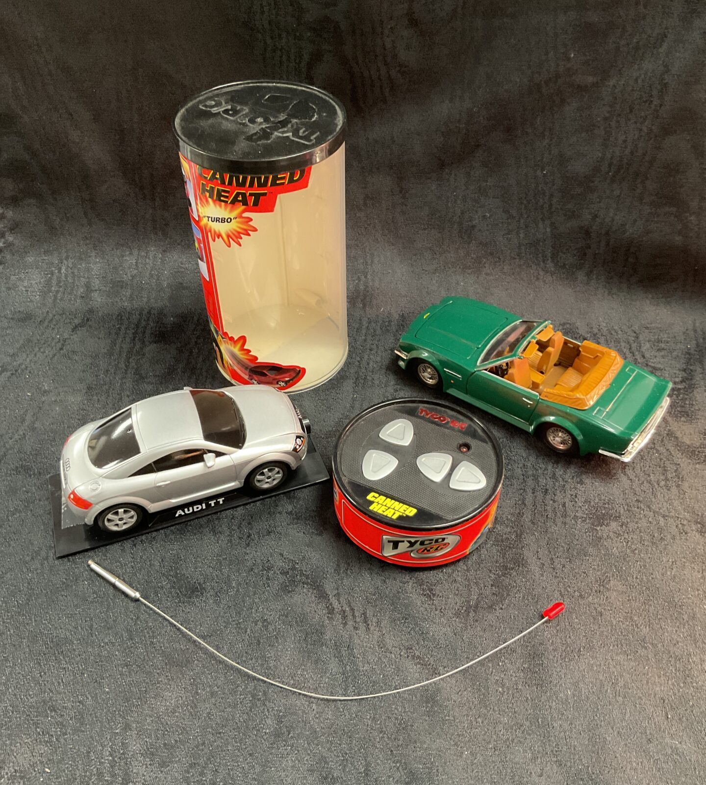 Vintage RC Tyco Audi TT and Aston Martin V8 remote control cars.