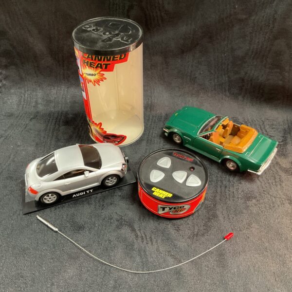 Vintage RC Tyco Audi TT and Aston Martin V8 remote control cars.
