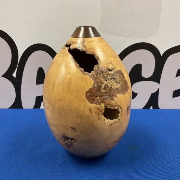 R d Antmann field maple vase with irregular opening and natural wood grain.