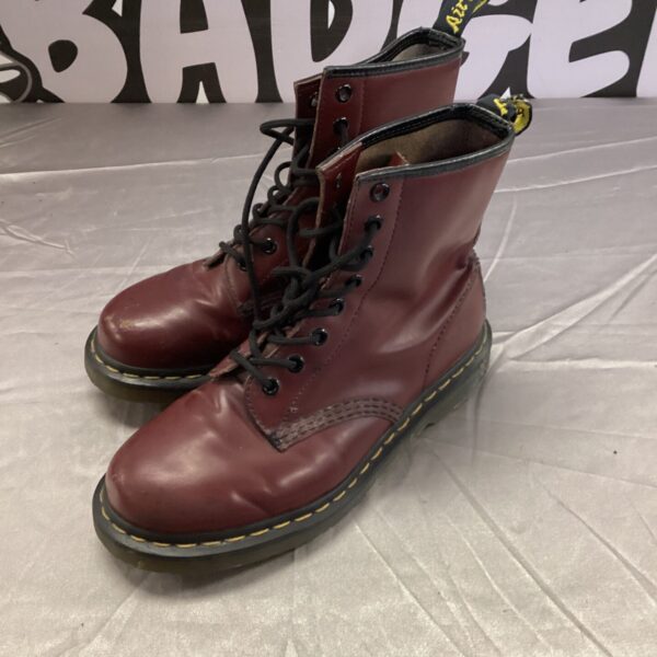 Vintage red Dr Martens boots size 4, classic leather footwear.