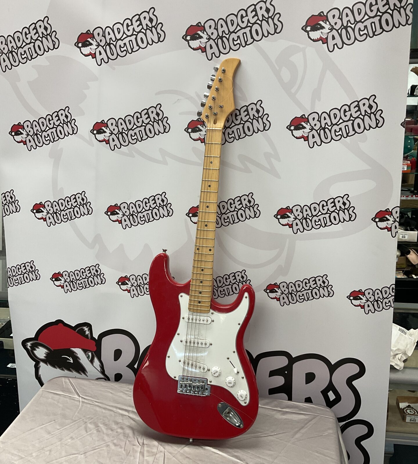 Vibrant red electric guitar with chrome hardware.