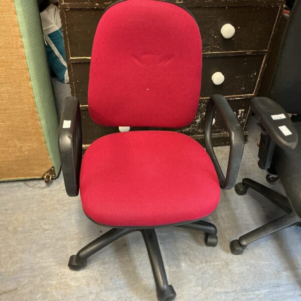 Red office chair with adjustable height and swivel function.