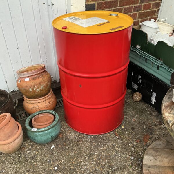 Red oil drum, a vintage industrial storage container.
