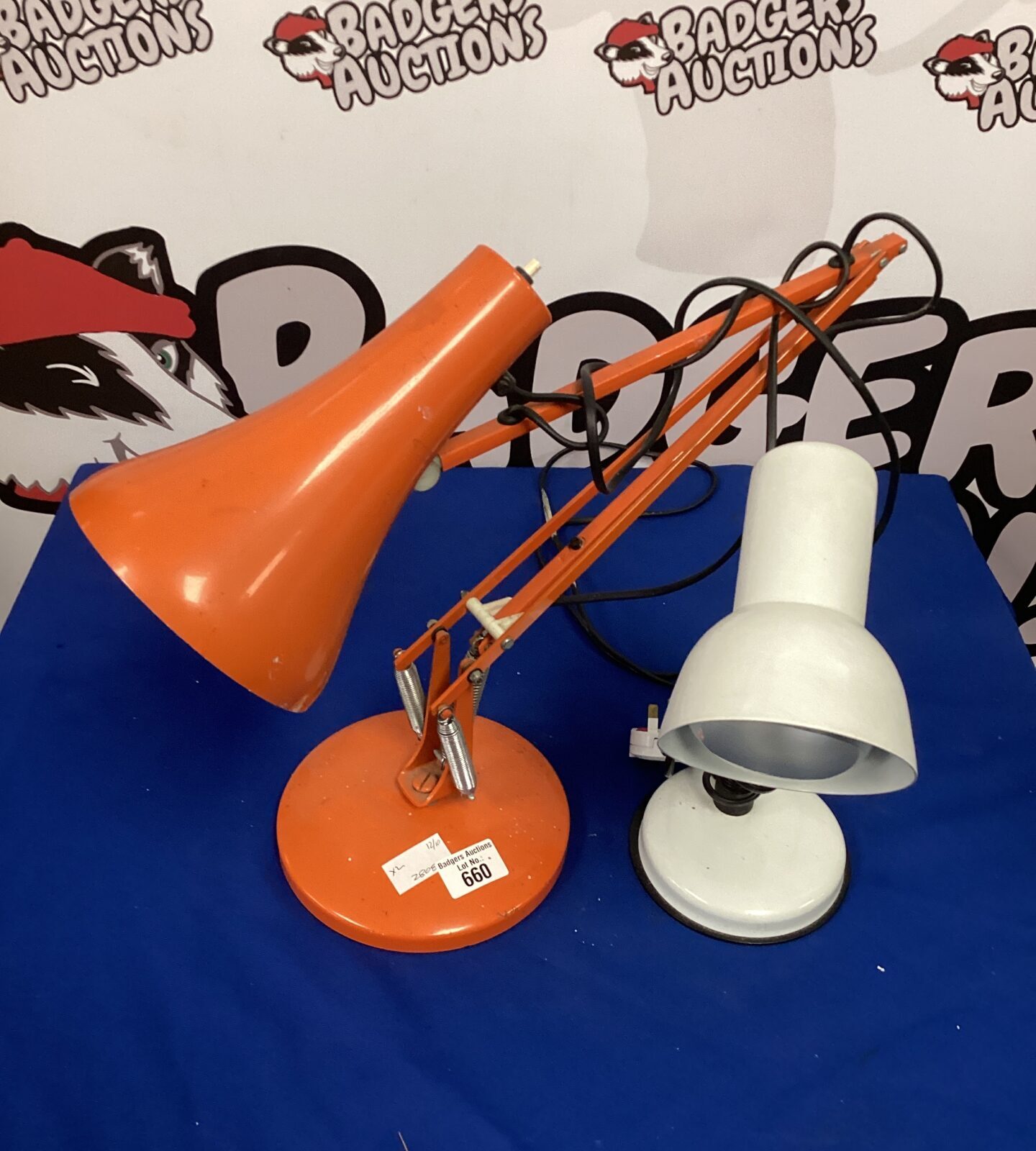 Red vintage Anglepoise lamp with adjustable arm.