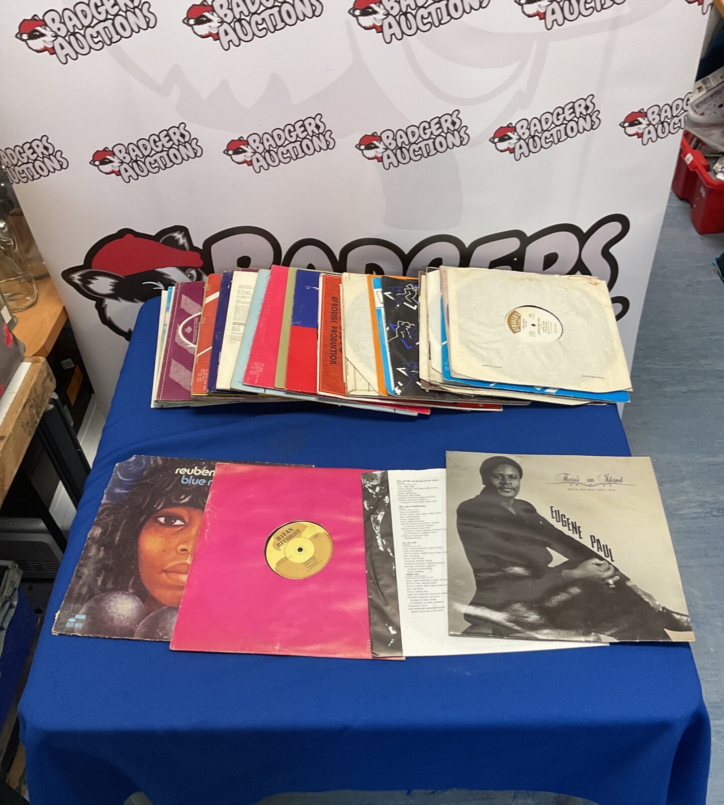 Collection of vintage reggae vinyl LP records on a table.