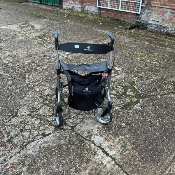 Rehasense walking aid trolley with basket, showing signs of use.