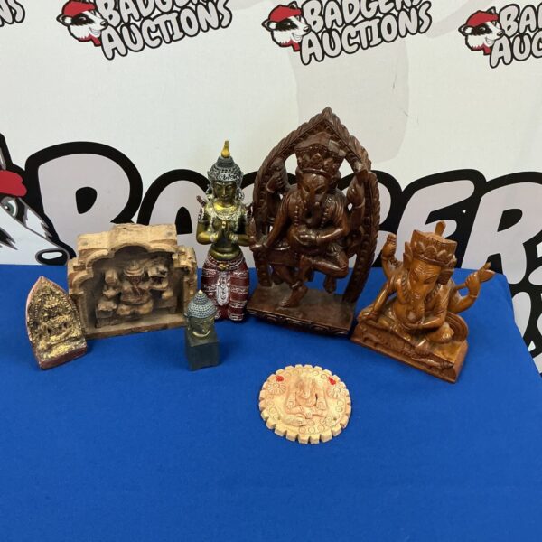 Vintage religious figurine collection featuring detailed Indian statues.