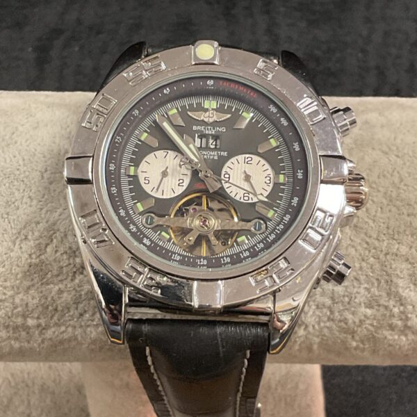 Black dial replica automatic wristwatch with stainless steel case.