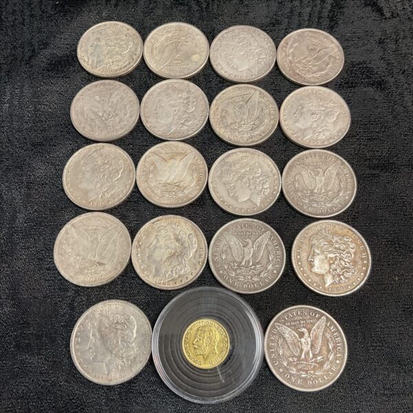 Reproduction Morgan Dollar and Sovereign coin set displayed for collectors.