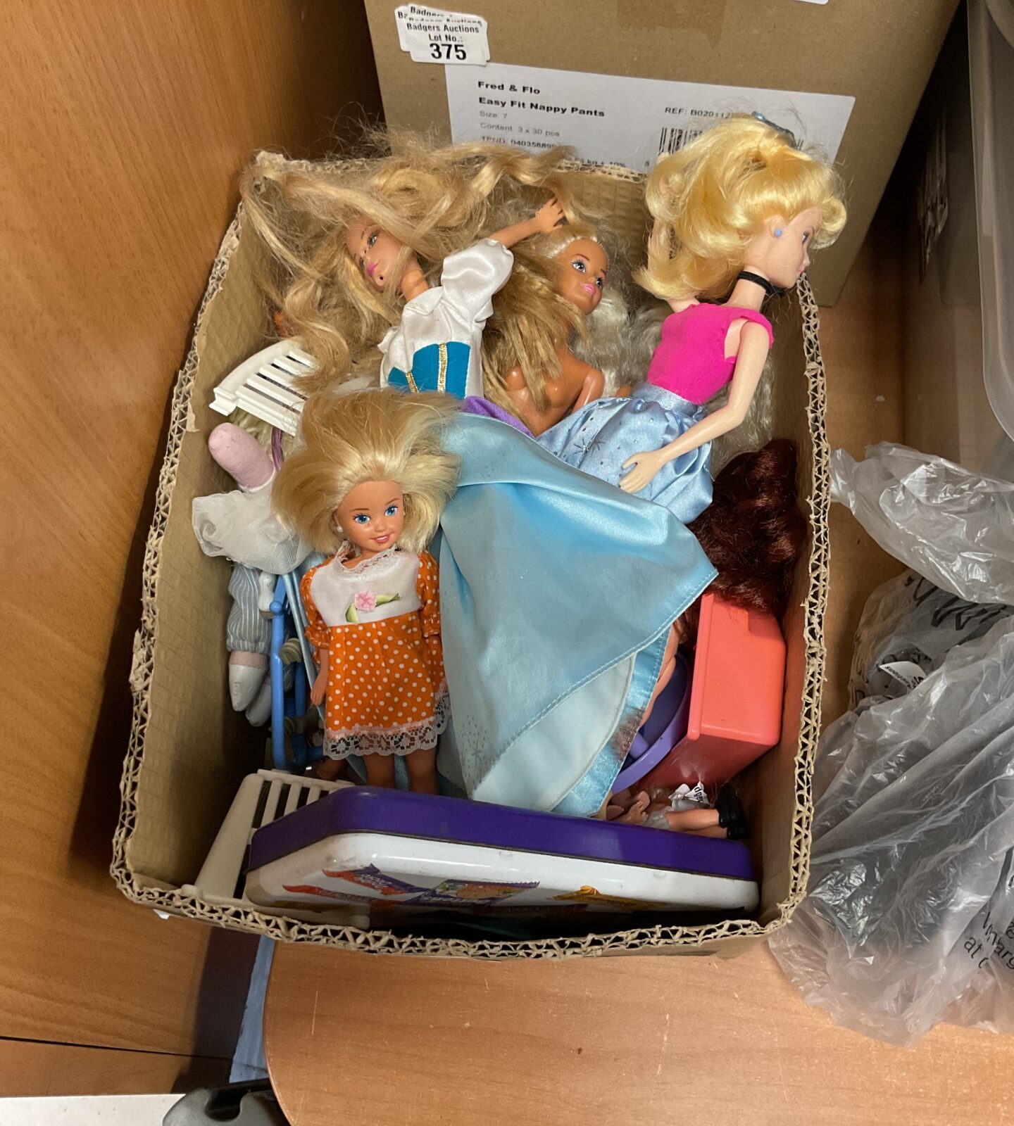 Vintage Barbie dolls and accessories in a colourful lot.