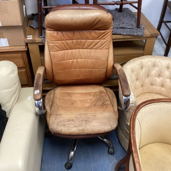 Vintage brown leather retro swivel chair with chrome base.