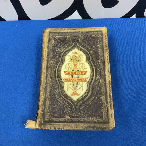 Antique Robert Burns Poetical Works book with embossed cover.