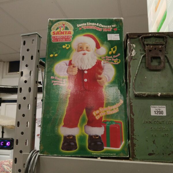 Vintage Rock Along Santa animatronic figure for Christmas decoration.