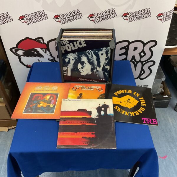 Collection of classic rock vinyl LPs including The Police, Steely Dan, and Ian Dury.