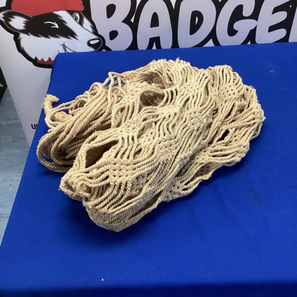Long length of natural fiber rope for hammock crafting.